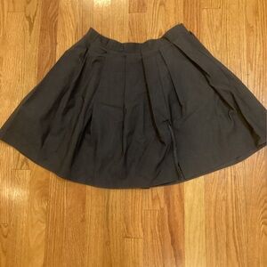 Pleated black miniskirt